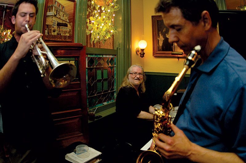 John Barnes on trumpet, Dr. Bob Rolands on alto saxophone, and George Mesterhazy seated at the piano. Photograph taken in June 2007 by Sharon Stabley and appeared in the August 2007 issue.