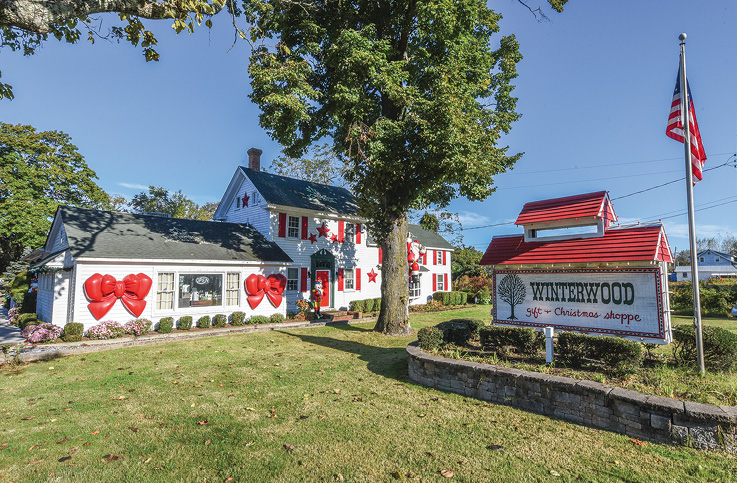 The white and red exterior of Winterwood Gift and Christmas Shoppe