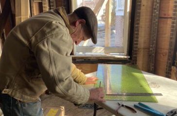 Bruce HIppel working on a stained glass window
