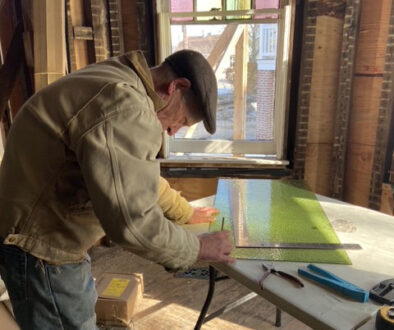 Bruce HIppel working on a stained glass window